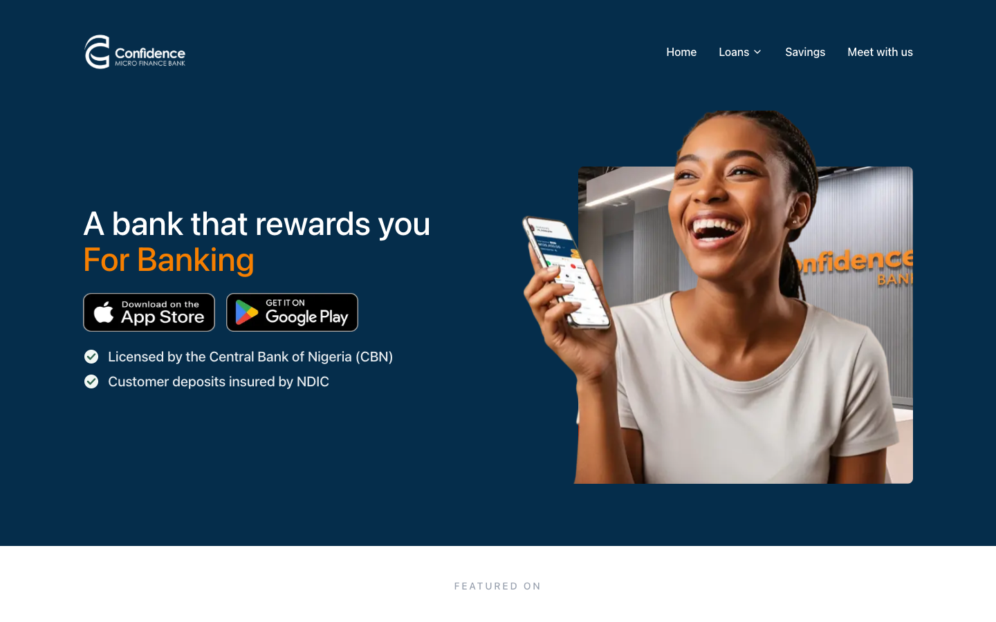 Confidence Micro Finance Bank homepage with a navy hero reading 'A bank that rewards you for banking', app store badges and a woman smiling at her phone